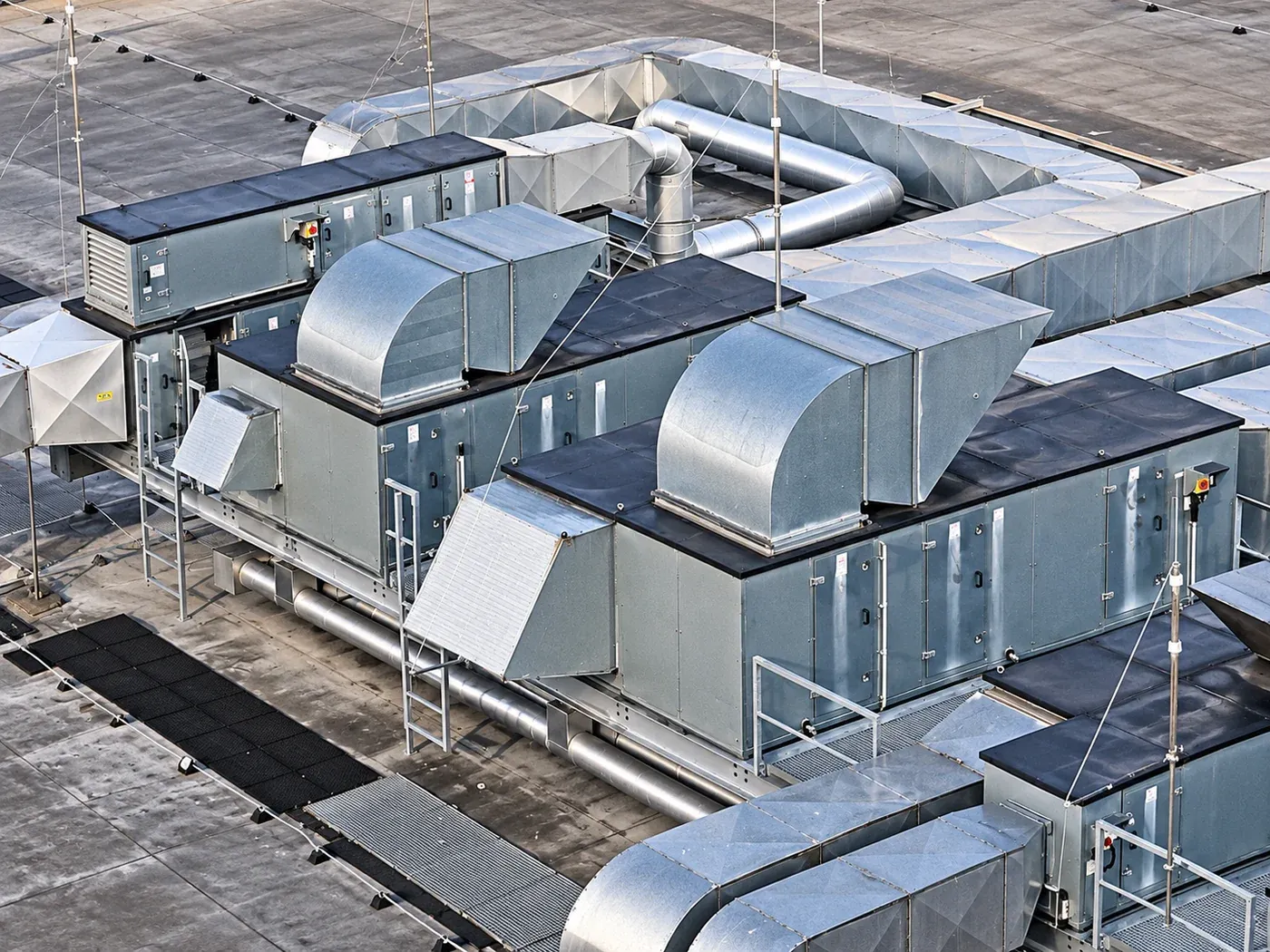 Rooftop central air-conditioning units and ductwork on a commercial building